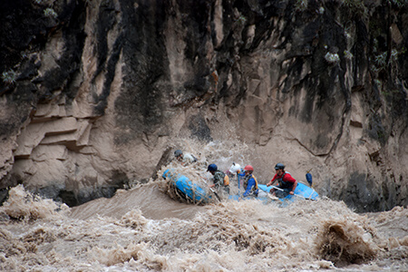 Paddle crew battling huge waves