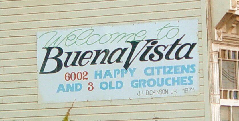 Building sign reading, "Welcome to Buena Vista. 6002 happy citizens and 3 old grouches." Photo taken by Ben Schumin on September 21, 2005.
