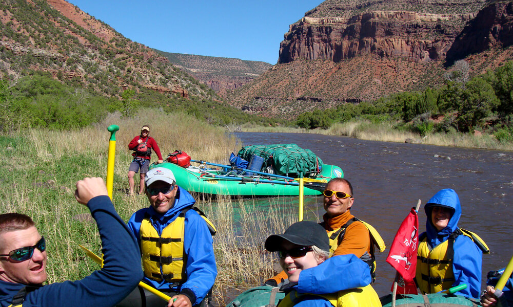 rafter on an overnight Dolores river trip smile for the camera