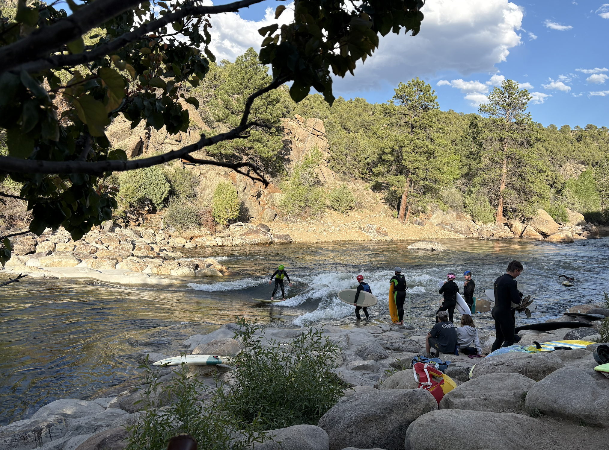 People surfing the river wave in buena vista