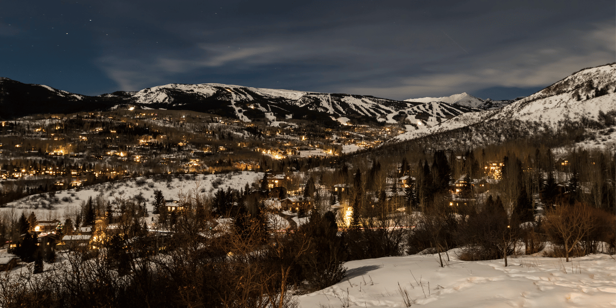Snowmass village at night in the snow.