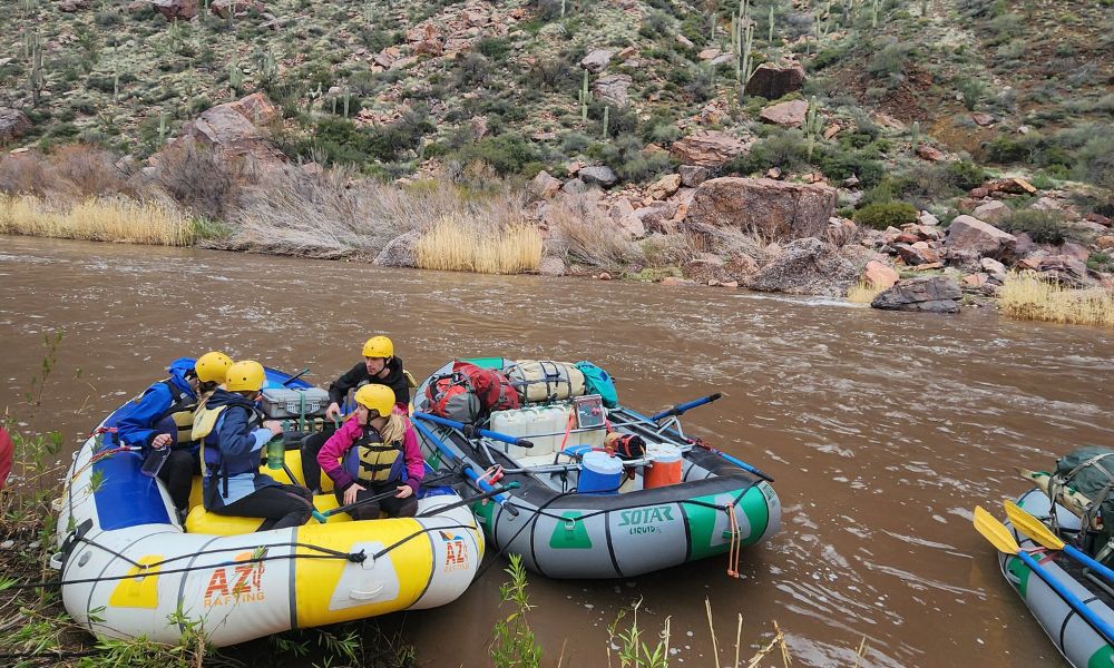Two rafts sit on the shore of the salt river